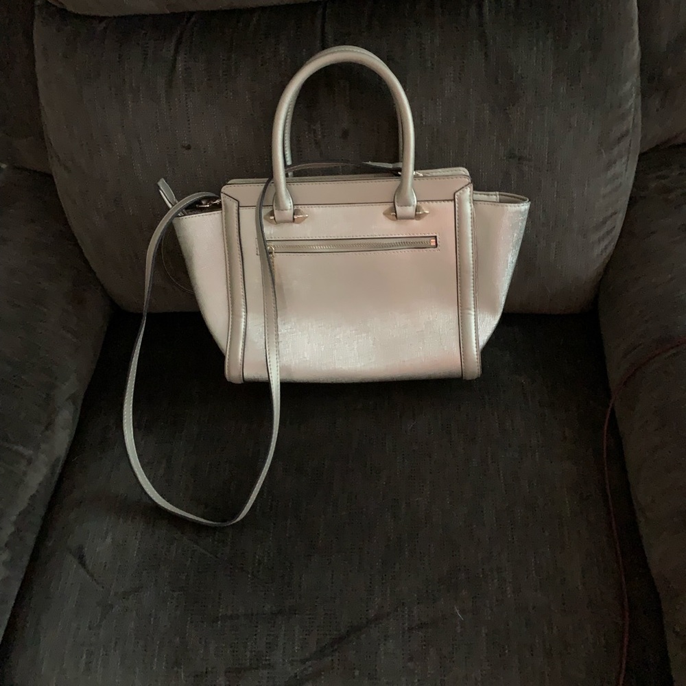 A very nice cross body bag measuring 10in by 8 in with lots of room inside.